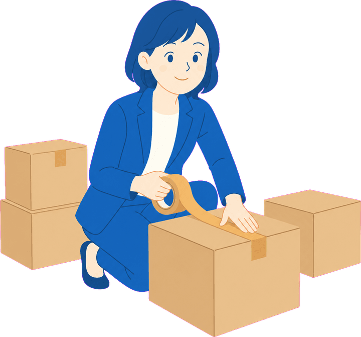引越しの荷造りをする女性